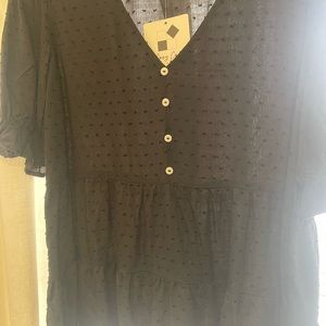 Black Swiss dot top with tags